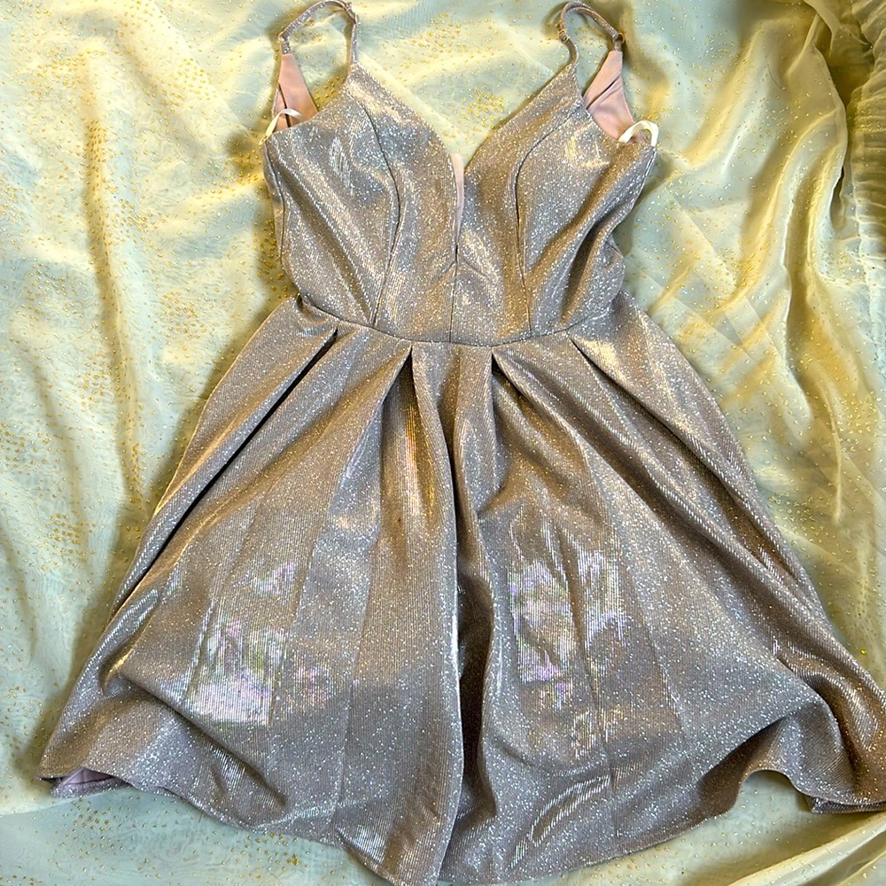 Pink homecoming dress. Bought it a year ago from Macys.